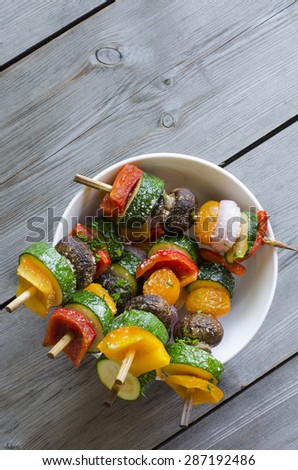 Grilled Vegetable shish Kebab with peppers, mushrooms, tomatoes, zucchini and onions as texture or background. Healthy diet concept.