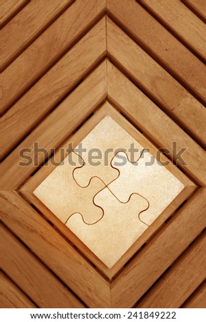Wooden Jigsaw puzzle surrounded by wood