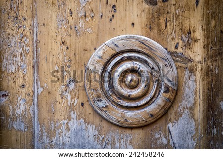 Decorative circle on an old wooden door. Horizontal composition
