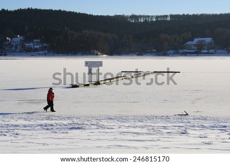 Sunny afternoon in winter at frozen lake