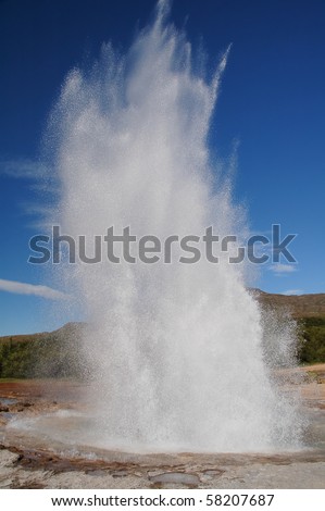 Geyser Strokkur on Iceland erupting hot water and steam, series of shots of the erupting geyser fontain, from the beginning to the end.