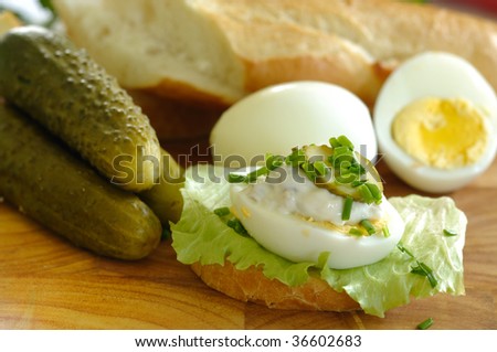 Fresh breakfast consisting of egg sandwich and gherkins