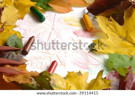 Drawing autumn leaves with crayons