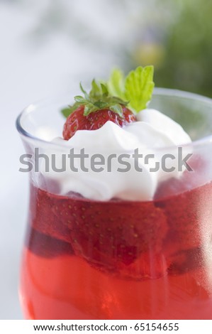Strawberry jelly dessert with cream