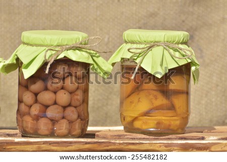 Jars with fruity compotes . Preserved fruits.