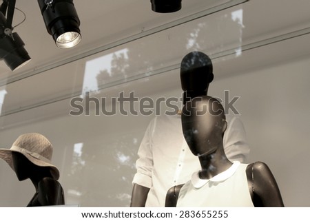Male and female mannequins, black and white effect, fashion store, with natural double exposure