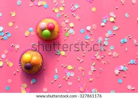 Cupcakes on pink confetti background  - happy birthday card