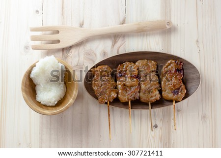 Thai-styled grilled pork and sticky rice. It\'s among most popular street foods in Thailand
