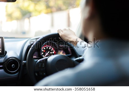 Close-up of Young man driving on the road