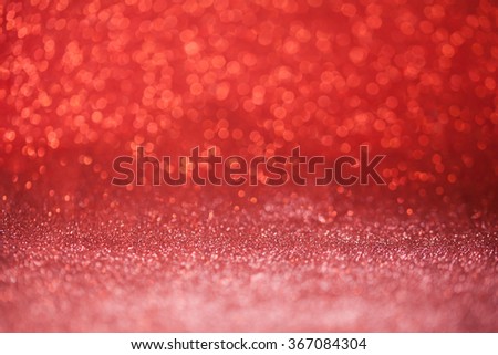 Red glitter surface with red light bokeh - It can be used for background for special occasions promotion campaign or product display