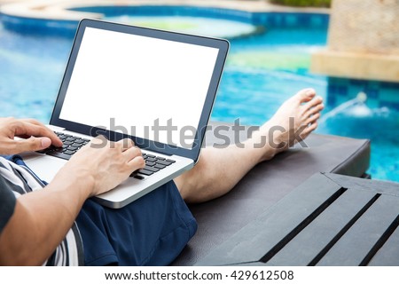 Screen mockup of laptop that a man is using in the pool on vacation - work anywhere and internet work concept