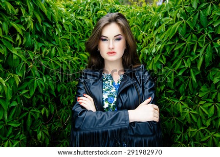 Woman in black leather jacket