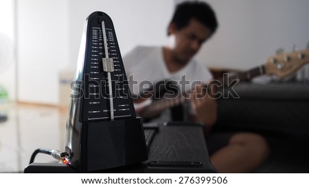 Black metronome is used by musician to help keep a steady tempo as he play, or to work on issues of irregular timing, or to help internalize a clear sense of timing and tempo.