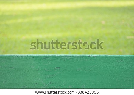 Green wood at bottom and blurred green natural in background, copy space for text