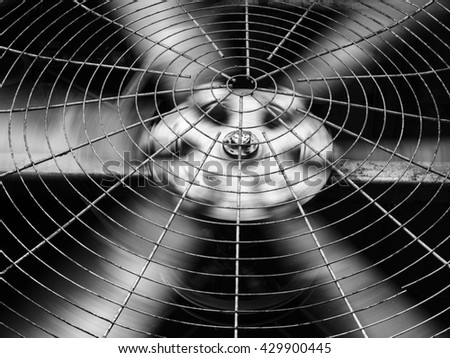 Black and white HVAC (Heating, Ventilation and Air Conditioning) spinning blades. Industrial ventilation fan background. Air Conditioner Ventilation Fan.