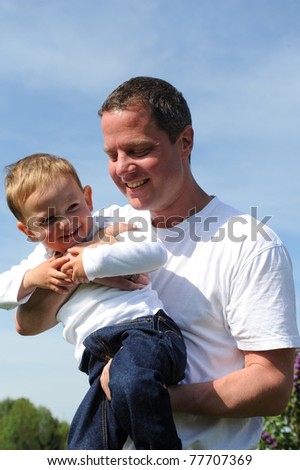 Happy young father with his 2 years old son