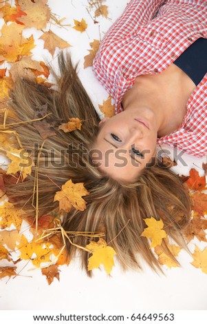 looking down at teenager laying in the leaves