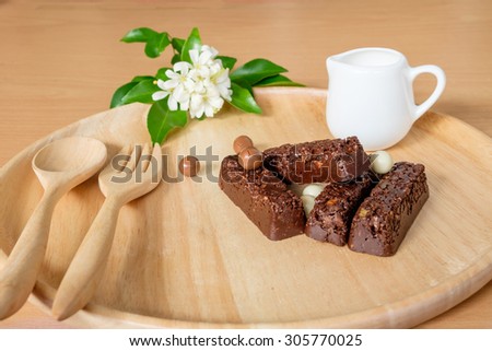 chocolate crunchies bar with chocolate ball on wooden board