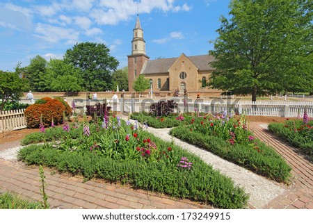 Williamsburg, Virginia - April 21 2012: Gardens Of Colonial Williamsburg In Front Of Bruton Parish Church In Spring. The Restored Town Is A Major Attraction For Tourists And Meetings Of World Leaders.