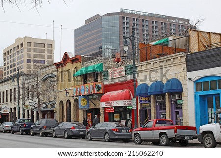 AUSTIN, TEXAS - FEBRUARY 3 2014: Bars, restaurants and other businesses in the Sixth Street Historic District, a major tourist destination that is listed in the National Register of Historic Places.
