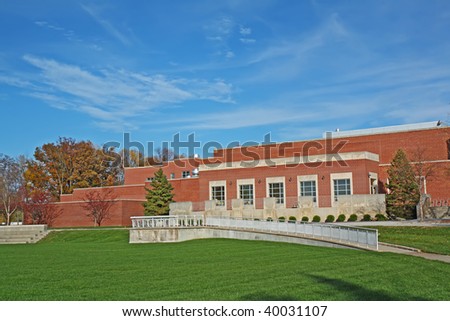 Schwitzer Student Center on the campus of the University of Indianapolis in Indiana with blue sky and white clouds