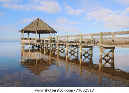 Public gazebo and dock with blue sky and white clouds over Whale Head Bay off of Currituck Sound on the Outer Banks near Corolla, North Carolina