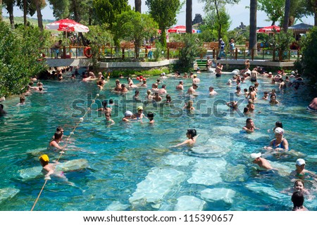 PAMUKKALE, TURKEY - MAY, 4: Tourists swim in Cleopatra\'s pools on May 4, 2012 in Pamukkale, Turkey. Cleopatra\'s pools made for queen Cleopatra nowadays become one of the most visited sight in Turkey.