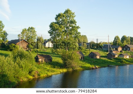 Old rural houses on the river bank