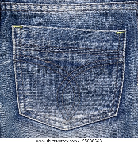Jeans pocket. Fragment of jeans. Denim textured backdrop.