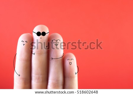 Four fingers decorated as four  friends. Three of them trying to cheat on their friend.