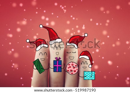 Four fingers decorated as happy friends receiving gifts.