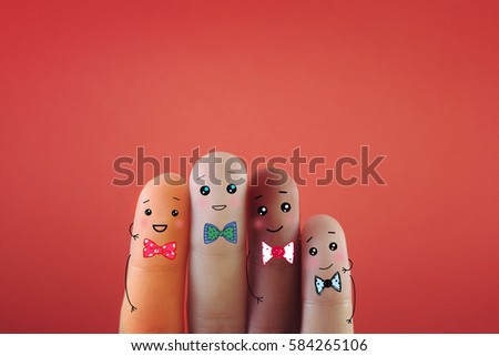 Four fingers decorated as four person with different skin color.Suitable for anything against racism.