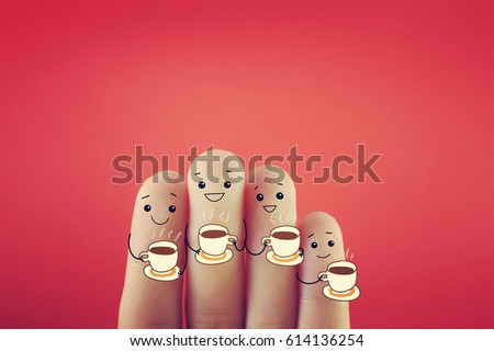 Four fingers decorated as four person drinking hot drink.