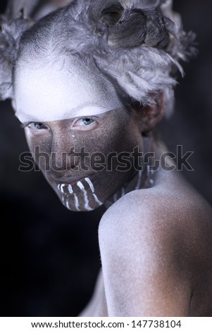 Young beautiful fashion model with creative makeup close-up portrait.Halloween