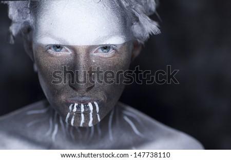 Young beautiful fashion model with creative makeup close-up portrait.Halloween