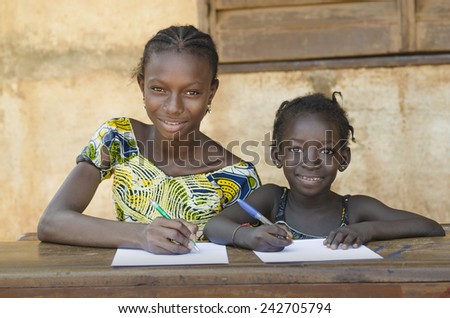 School For African Children - Couple Smiling Whilst Learning