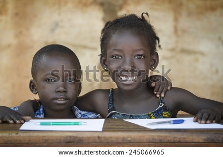 Education Symbol: Couple of African Children Smiling at School