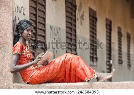 Learning Symbol: Education for Africa Young Woman Working On Tablet