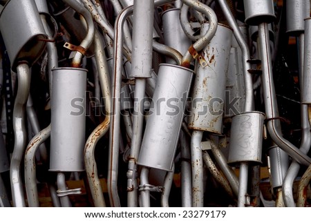 Lot of exhaust pipes stacked in absolutely no order