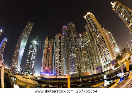 Dubai Marina by night. Dubai Marina skyscrapers. Cayan tower. Princess tower. Torch tower.