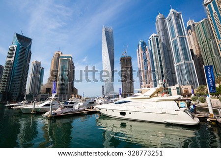 DUBAI - NOVEMBER 16: Dubai Marina skyline. Dubai Marina cityscape. Dubai Marina Yachts.  Dubai Marina skyscrapers, Cayan Tower, Princess Tower, The Torch Tower on November 16, 2014 in Dubai