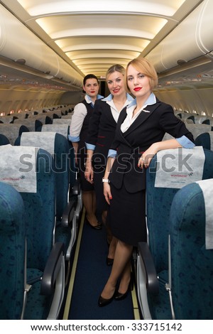 Boryspil, Ukraine - MAY, 2015: Beautiful flight attendants in an airplane. Airbus A320 cabin crew. Aircraft cabin crew. Portrait of stewardesses in an airplane on May 20, 2015 in Boryspil