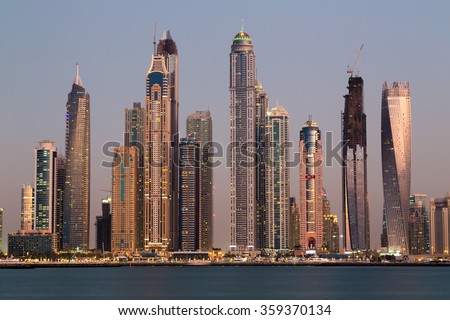 DUBAI, UAE - NOVEMBER 15: Dubai Marina skyline.Dubai skyline. Dubai cityscape.Dubai skyscrapers. Urban view.Dubai futuristic. Dubai sunset.Cayan Tower. Dubai Marina 101 on November 15, 2015 in Dubai
