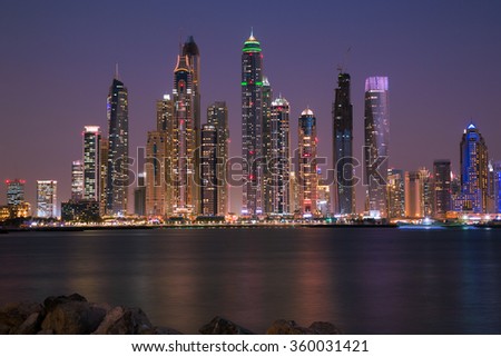 Dubai Marina night skyline. Dubai Marina bay. Dubai marina skyscrapers. Dubai skyline.Dubai by night.Dubai cityscape.Dubai iconic view.Dubai Cayan tower, Marina 101, Princess tower.Modern city.