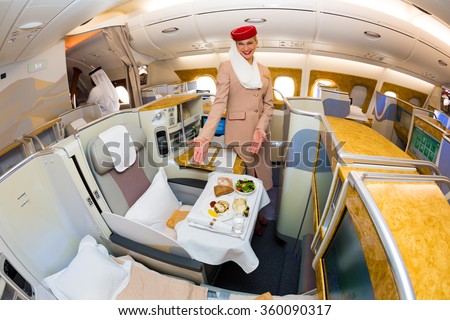 Dubai, UAE - NOVEMBER 09, 2015: Emirates Airbus A380 cabin crew member, flight attendant. Emirates stewardess, Airbus A380 upper deck. Emirates Airbus A380 business class on November 09, 2015 in Dubai