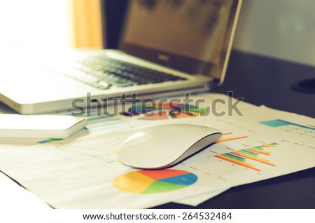 business documents and smart phone with charts growth, keyboard. Vintage