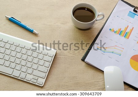 business documents with charts growth,coffee and pen. workplace businessman
