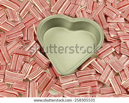 Heart tin, surrounded by candy and sweets