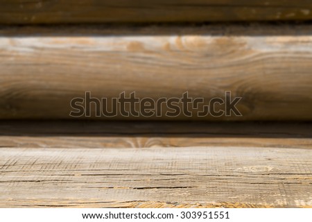 Country house wood bench part with blurred background timber wall