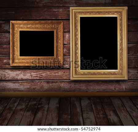 wooden grunge interior with two picture frames